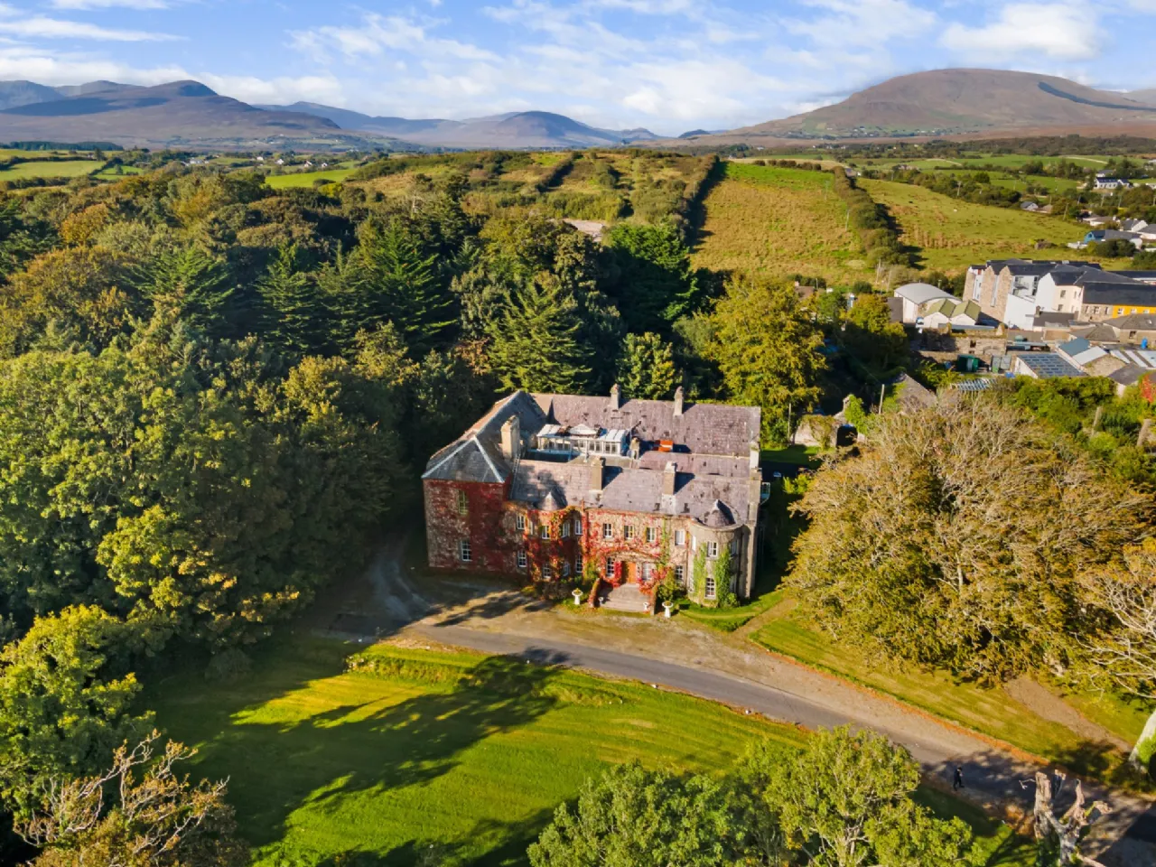 Aerial view of Newport House and its grounds, with the Nephin Beg mountains beyond